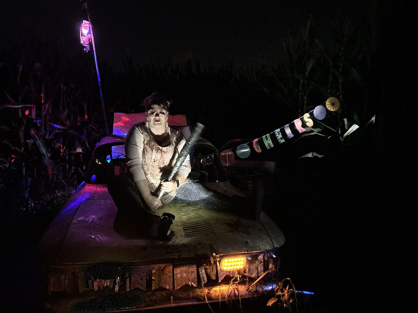 Costumed haunted maze actor on a truck