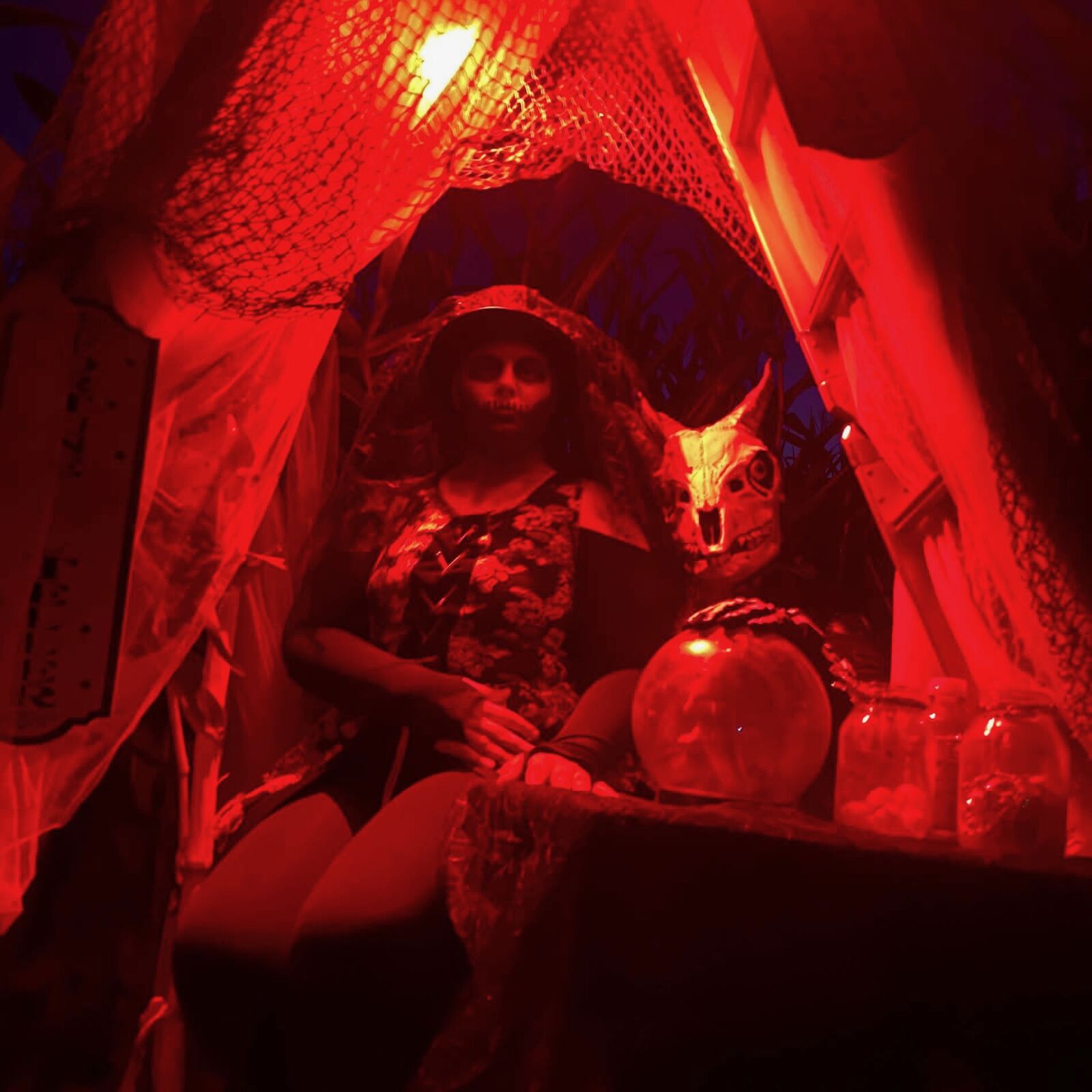 Fortune teller scene lit in red in the corn maze